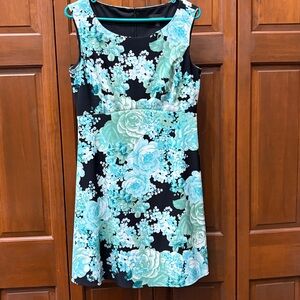 Sleeveless black, white, green, and blue floral A-line dress